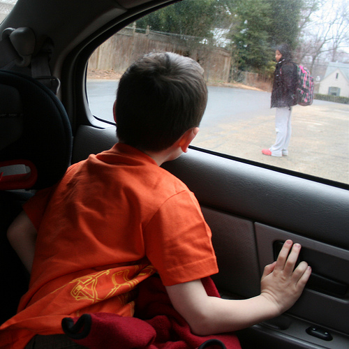 Child looking out a car window