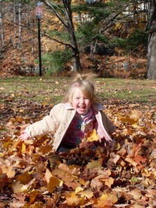 Playing in leaves Penacook NH by Jessica Lang